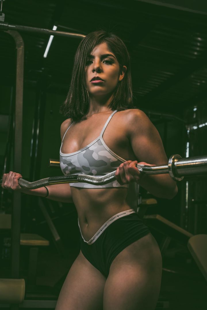 An athlete training with a barbell at the gym